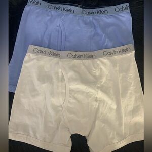 NWOT 2 pair of Calvin Klein boxer briefs. One white and one blue size 12/14